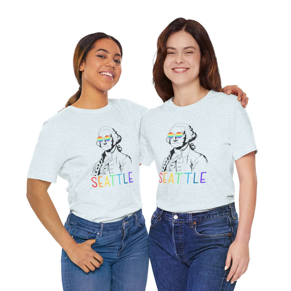 Two people wearing George's Rainbow Vision Seattle tee with rainbow glasses and lettering, celebrating Pride and inclusivity.