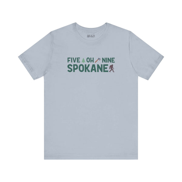 "Five Oh Nine Roots Soft Tee featuring Spokane pride design with axe and tree flourish, perfect for showing local hometown spirit"