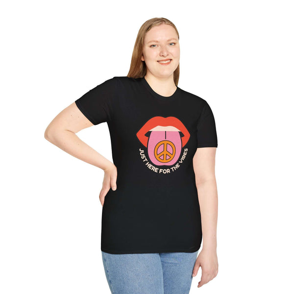 Woman in a black t-shirt with 'Just Here for the Vibes' graphic, promoting a laid-back lifestyle.