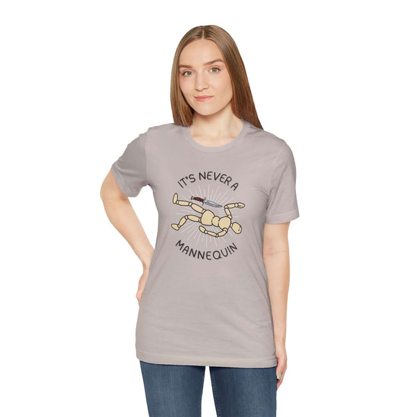 Woman wearing It's Never a Mannequin true crime tee, showcasing a playful design for true crime fans.