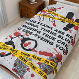 The Crime Scene Snuggle Lightweight Blanket for True Crime Lovers featuring blood stains and crime scene tape.