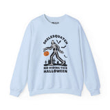 Skelesquatch Halloween sweatshirt featuring skeleton Sasquatch in graveyard with trick-or-treat bucket, spooky bats, and grave markers.