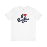 I love Seattle t shirt featuring a cursive design in red and navy on a white background.
