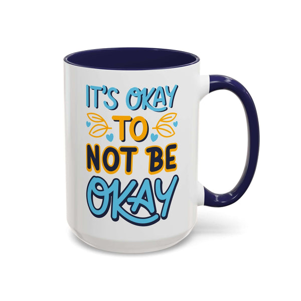 It's Okay To Not Be Okay Mug with colorful hand-lettered message and contrasting navy handle.