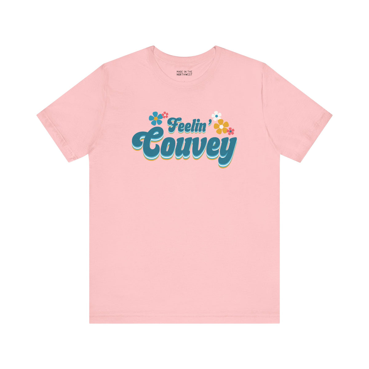 Feelin' Couvey retro premium soft tee in pink featuring 70s font and colorful flowers, celebrating Vancouver's spirit.