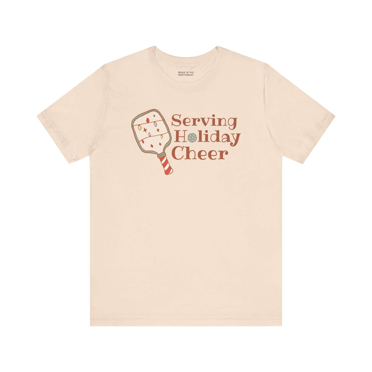 Serving Holiday Cheer Pickleball T Shirt featuring a festive paddle design with Christmas lights.