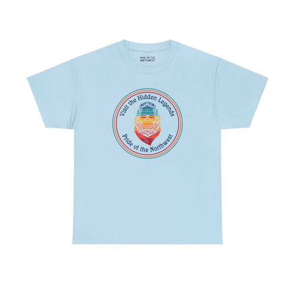 Light blue tee featuring vibrant Bigfoot graphic and "Visit the Hidden Legends, Pride of the Northwest" text, celebrating Pacific Northwest spirit.