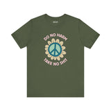 Green premium soft tee with 'Do No Harm, Take No Sh!t' design and peace flower graphic.
