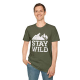 Man wearing a Stay Wild T Shirt with distressed mountain design, perfect for outdoor adventures.
