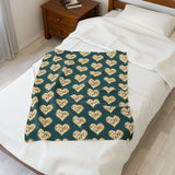 Oregon State of Mind Heart Lightweight Cozy Blanket displayed on a bed, showcasing Oregon pride in a stylish design.