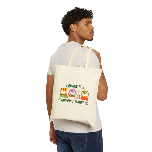 I Brake for Farmer’s Markets Tote being carried by a person wearing a casual outfit.