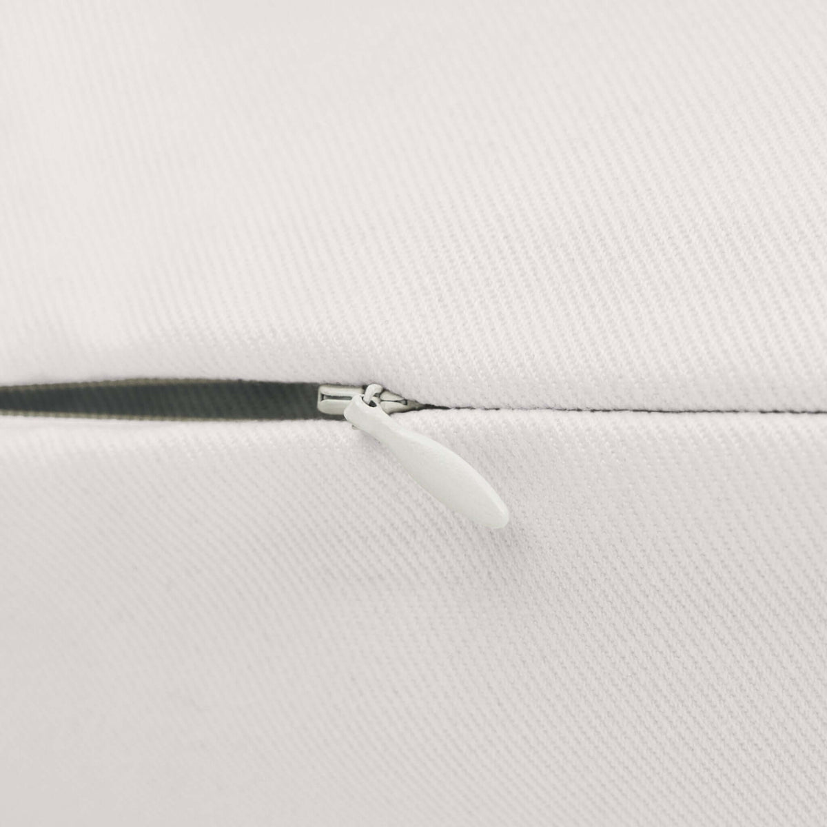 Though She Be But Little She is Fierce Pillow close-up of zipper detail on a soft, creamy fabric.
