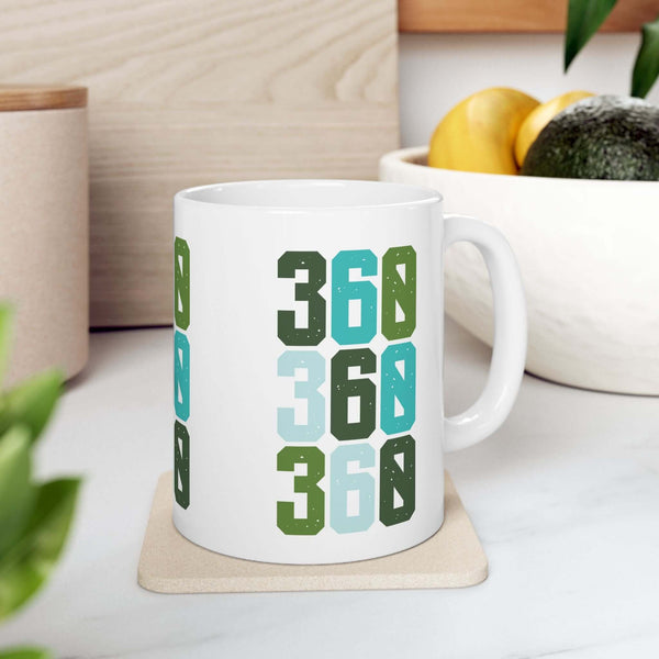 Three-Six-Oh Pop Vancouver ceramic mug featuring colorful 360 design, perfect for morning coffee.