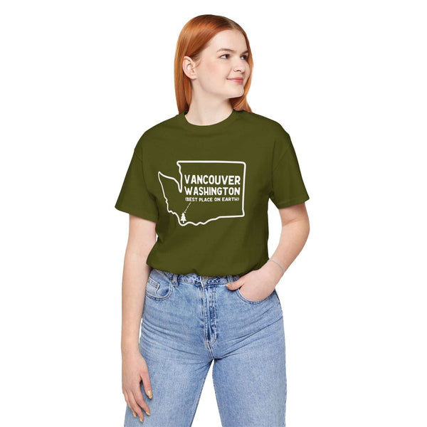 Person wearing green Vancouver Washington tee with state outline and tree icon, showcasing hometown pride and Pacific Northwest charm.