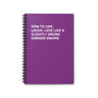 Spiral notebook with purple cover titled 'How to Live, Laugh, Love Like a Slightly Drunk Garden Gnome'.