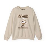 Light beige sweatshirt with the phrase 'First I Drink the Coffee Then I Do the Things' and a coffee cup graphic.
