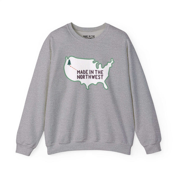 Evergreen is Where It's At Sweatshirt Show your love for the Pacific Northwest with our exclusive "Evergreen is Where it's At" sweatshirt. This design features the woodgrain United States with a tree marking the PNW location, highlighted by an arrow and t