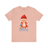 Light pink t-shirt featuring a playful gnome and the phrase 'Gnomebody Puts Baby in the Corner' for fun wardrobe flair.