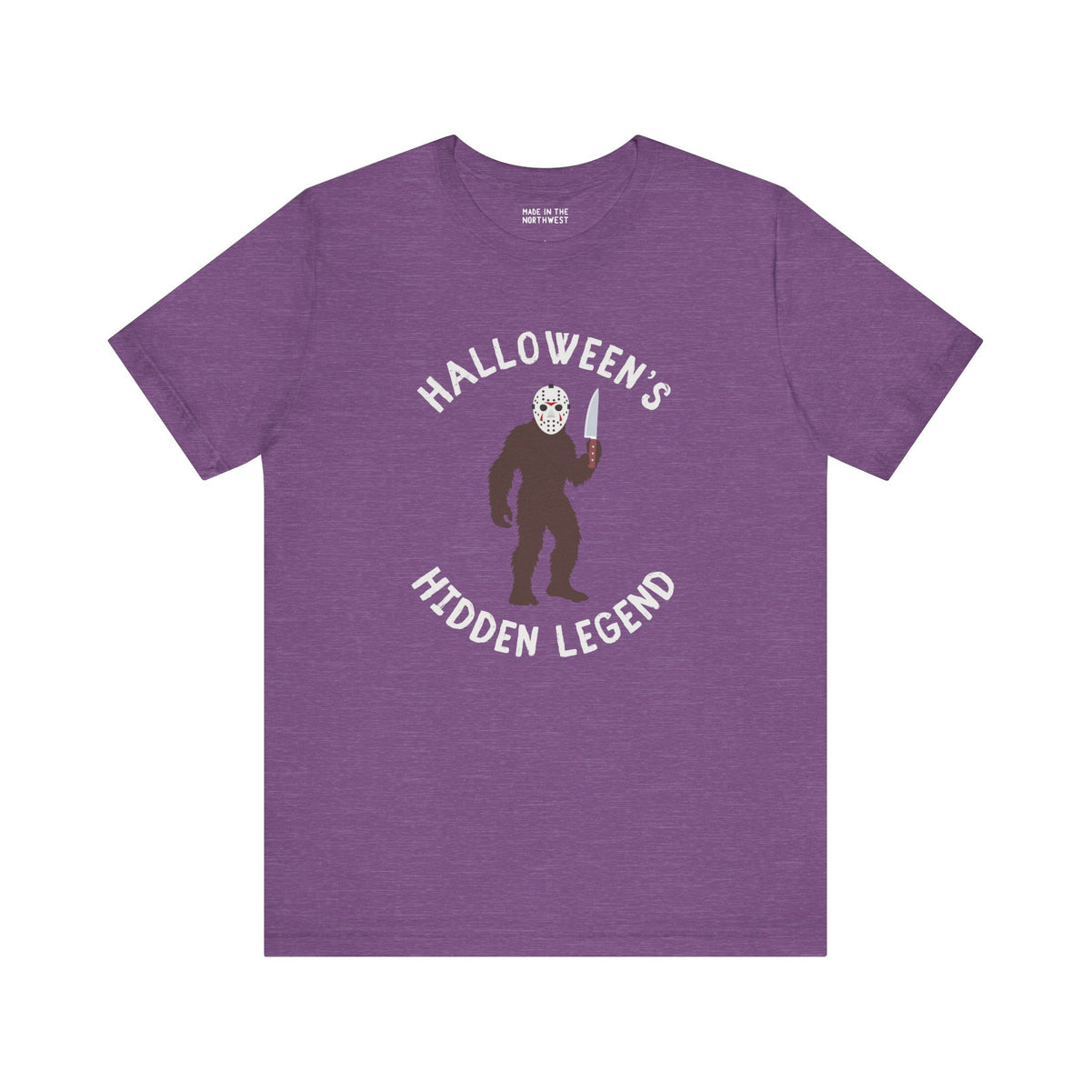 Halloween's Hidden Legend Bigfoot tee in purple, featuring Bigfoot in a Jason mask with a knife.