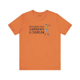 Never Underestimate a Woman with a Chainsaw Premium Soft Tee in orange, showcasing confidence and strength.
