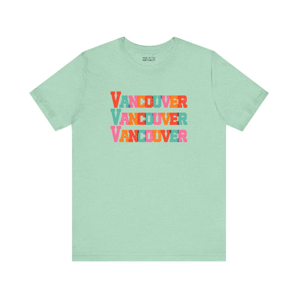 Mint green Vancouver trio design soft tee with bold, colorful block letters. Perfect for expressing love for the city.