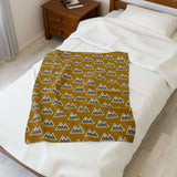 Pacific Northwest Heights Mountain Lightweight Cozy Blanket displayed on a bed, showcasing a bold mountain design.