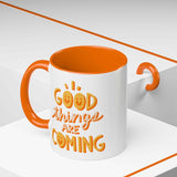 Good Things Are Coming Mug with cheerful design and vibrant orange interior, perfect for brightening morning routines.