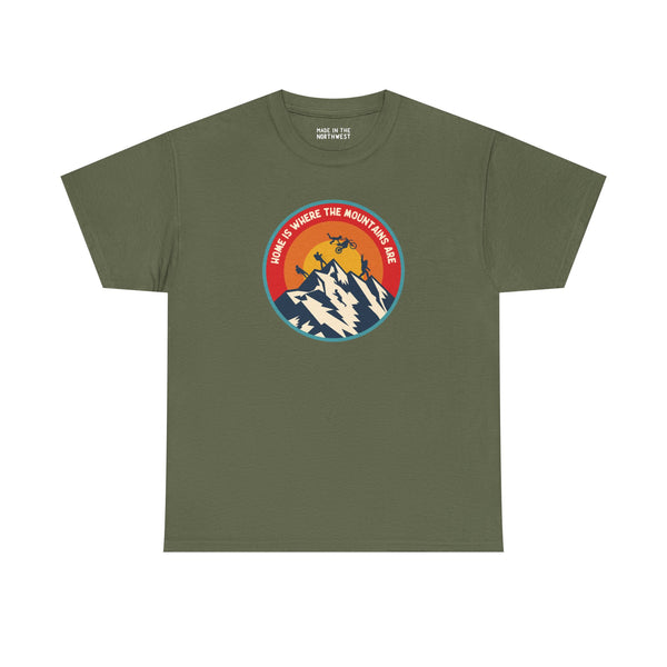 Olive green athletic tee featuring the design 'Home is Where the Mountains Are' with mountains and sun logo.