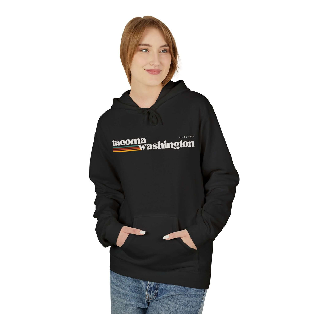 Woman wearing a retro Tacoma hoodie in black, featuring Tacoma Washington graphic and warm retro stripes.