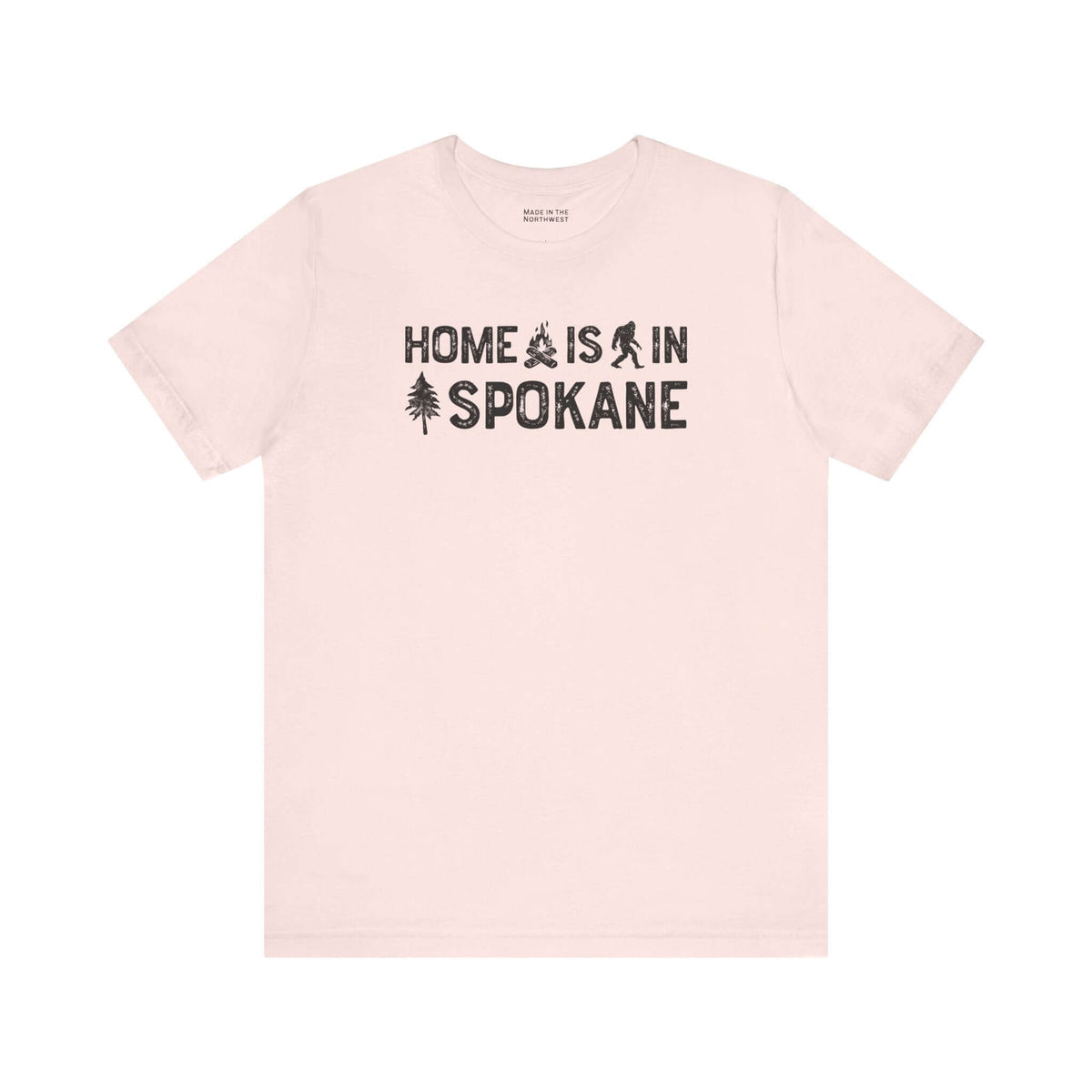 Home Is in Spokane Tee featuring campfire, Bigfoot, and tree illustrations representing Spokane pride.