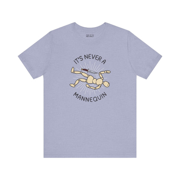 Light blue soft tee featuring 'It's Never a Mannequin' design, perfect for true crime fans.