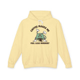 Coffee Makes Me Feel Less Murdery Hoodie in yellow with playful coffee graphic design.