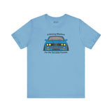 Light blue tee featuring BMW E30 325is design with 'A Driving Machine for the Sensible Fanatic' text.
