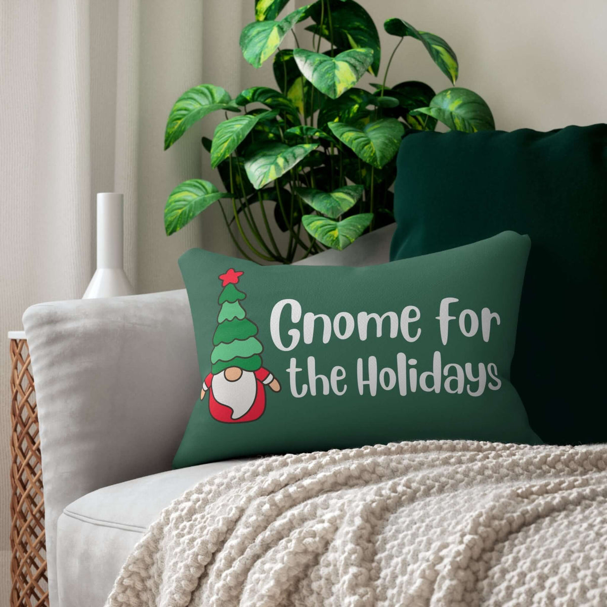 Gnome for the Holidays pillow on a cozy sofa with festive decor and greenery.