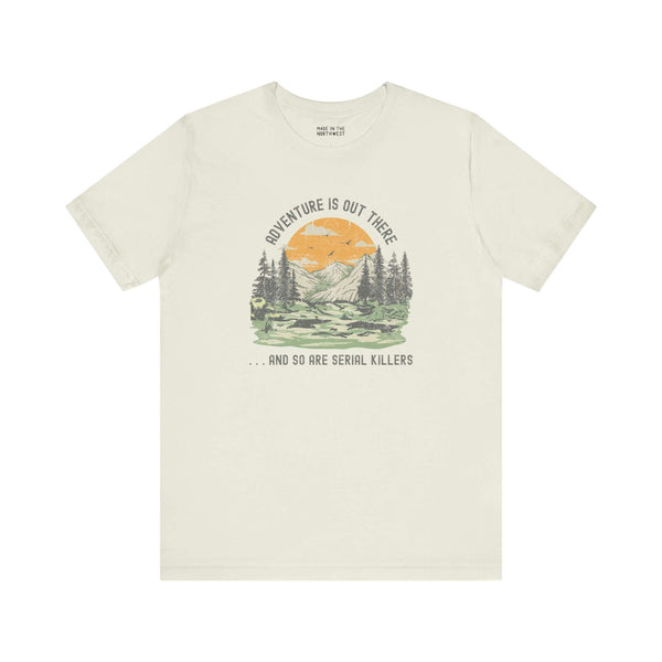 Premium soft tee with 'Adventure Is Out There... And So Are Serial Killers' design, perfect for true crime fans.