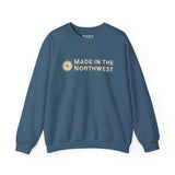 Made in the Northwest Sweatshirt featuring a compass design in a cozy blue color.