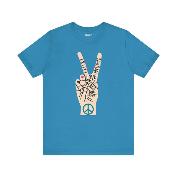 Power in Peace Premium Soft Tee featuring a hand making a peace sign with uplifting words promoting positivity.