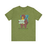 Green tee with a bear holding a map and backpack, featuring the text 