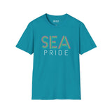 Bright teal SEA Pride t-shirt featuring colorful rainbow lettering representing Seattle's pride and community spirit.