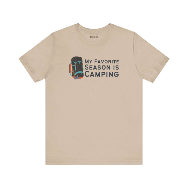 My Favorite Season is Camping Tee featuring a colorful backpack design on a beige shirt.