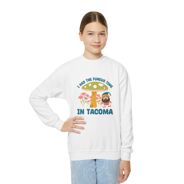Kid wearing I Had the Fungus Time in Tacoma sweatshirt featuring a mushroom house and gnome design.