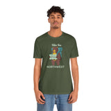 Hike the Northwest T Shirt worn by a model, featuring a playful bear design, perfect for outdoor adventures.