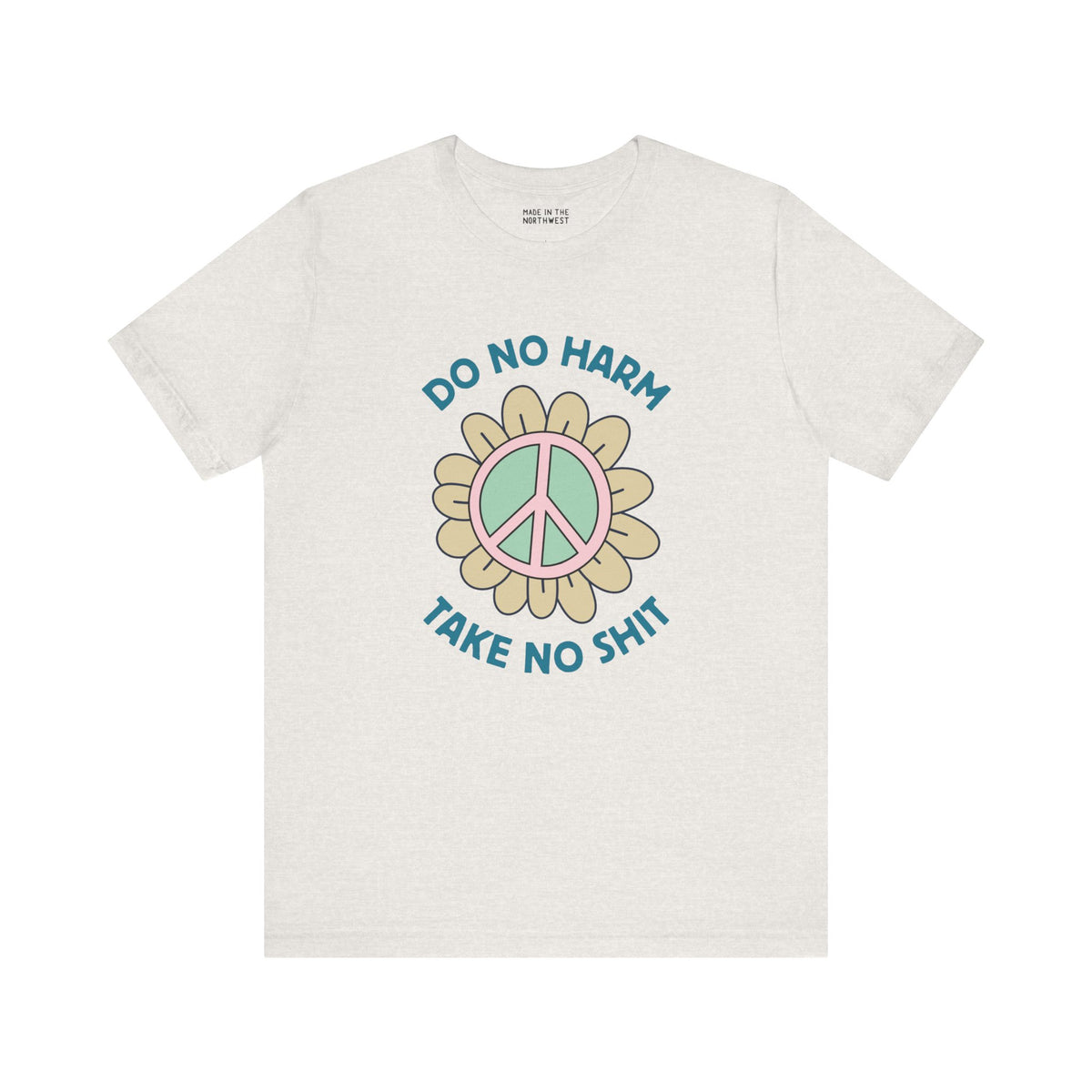 Premium soft tee featuring a peace flower design with 'Do No Harm, Take No Shit' slogan for a bold, uplifting style.