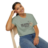 Woman wearing a Death Before Decaf T Shirt with skull coffee graphic, promoting caffeine lifestyle.