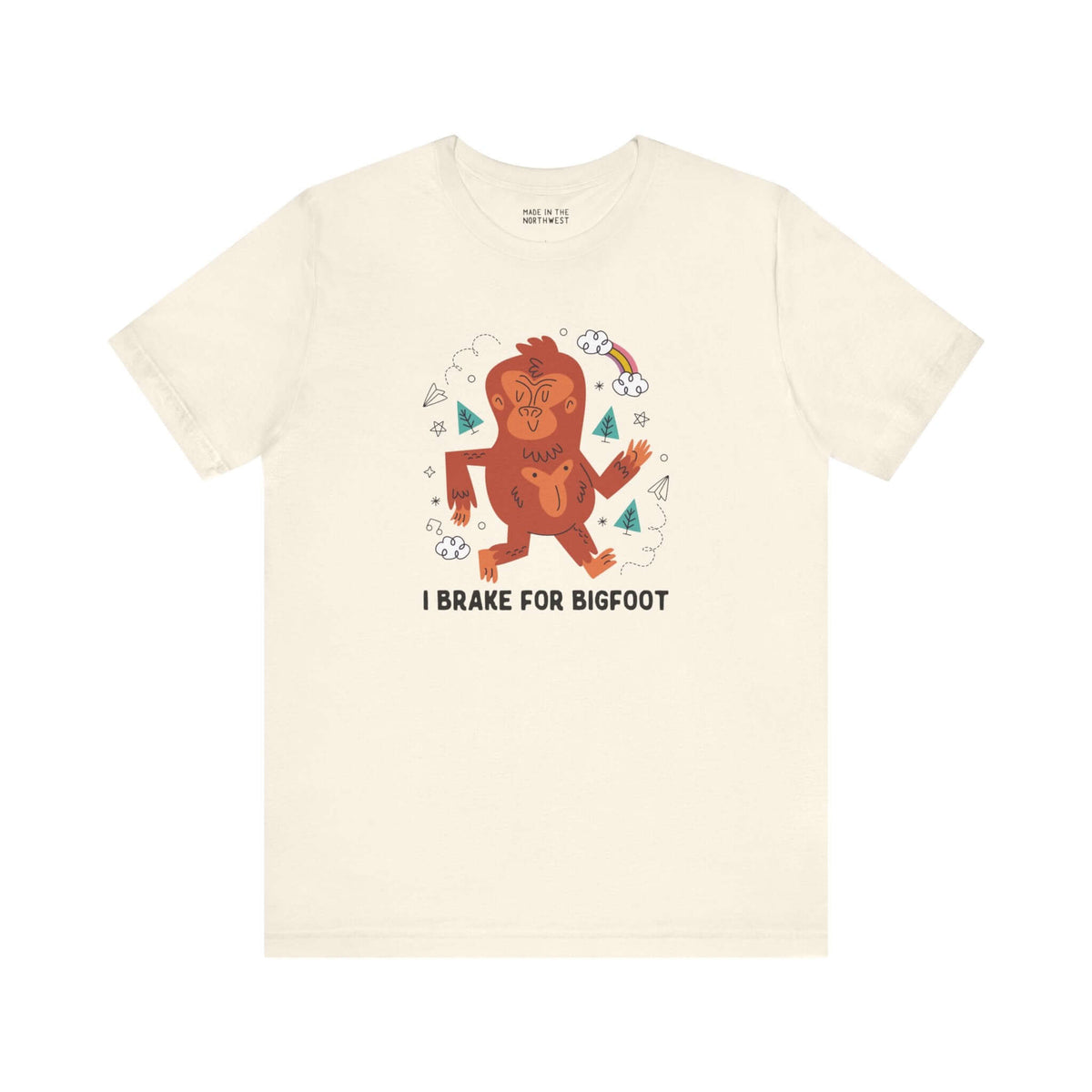 I Brake for Bigfoot Soft Tee Show your playful side and love for local folklore with our "I Brake for Bigfoot" Sasquatch Tee. This fun design features the phrase "I Brake for Bigfoot" alongside a whimsical graphic of a Sasquatch, perfect for those who enj