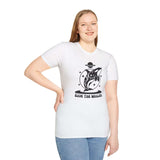 Woman wearing a Save the Whales Orca Softstyle T-Shirt with a mystical orca graphic and bold design.