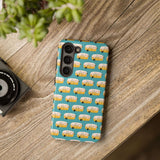 Happy Camper tough phone case with vintage camper design on a wooden table, perfect for adventure lovers.