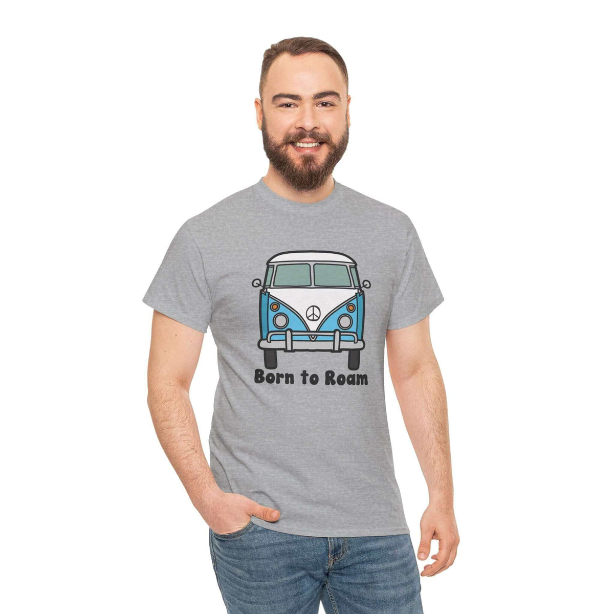 Man wearing a grey "Born to Roam" tee with a classic vanagon bus graphic and peace sign, perfect for those with a nomadic lifestyle.