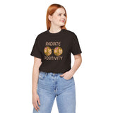 Unisex Radiate Positivity tee featuring vibrant floral glasses, promoting kindness and good vibes.