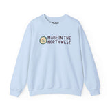 Light blue sweatshirt with 'Made in the Northwest' logo and compass design, perfect for showing Pacific Northwest pride.